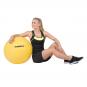 Gymnastický míč Antiburst 55 cm HAMMER žlutý - poměr s člověkem